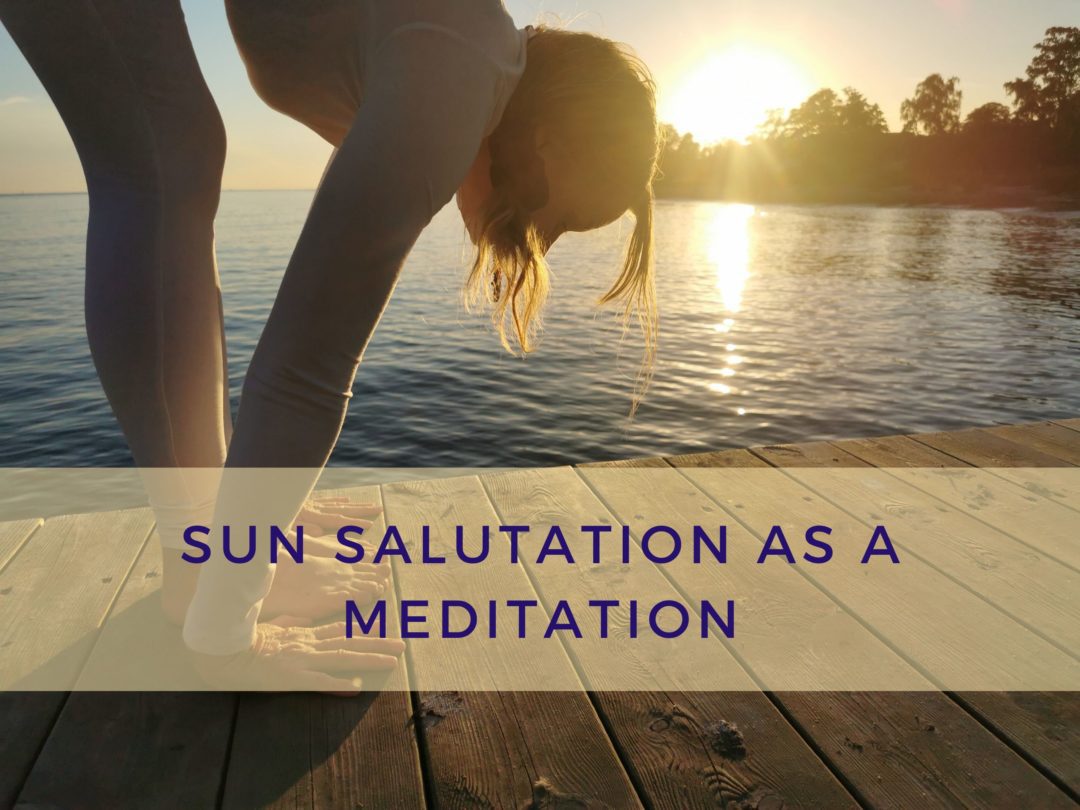 Yoga teacher practicing sun salutation as a meditation