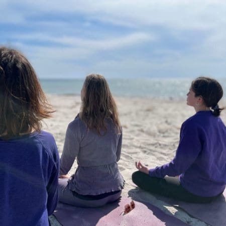 Yogis Meditating On The Beach | Yogi Living Ashram