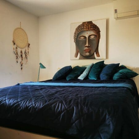 Master bedroom at yogi living with yogi artwork
